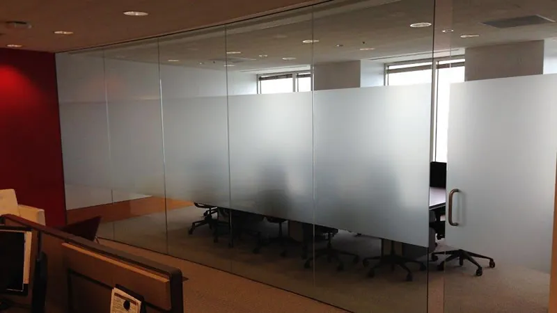 Office glass walls with a frosted band that blocks sightlines but not light.